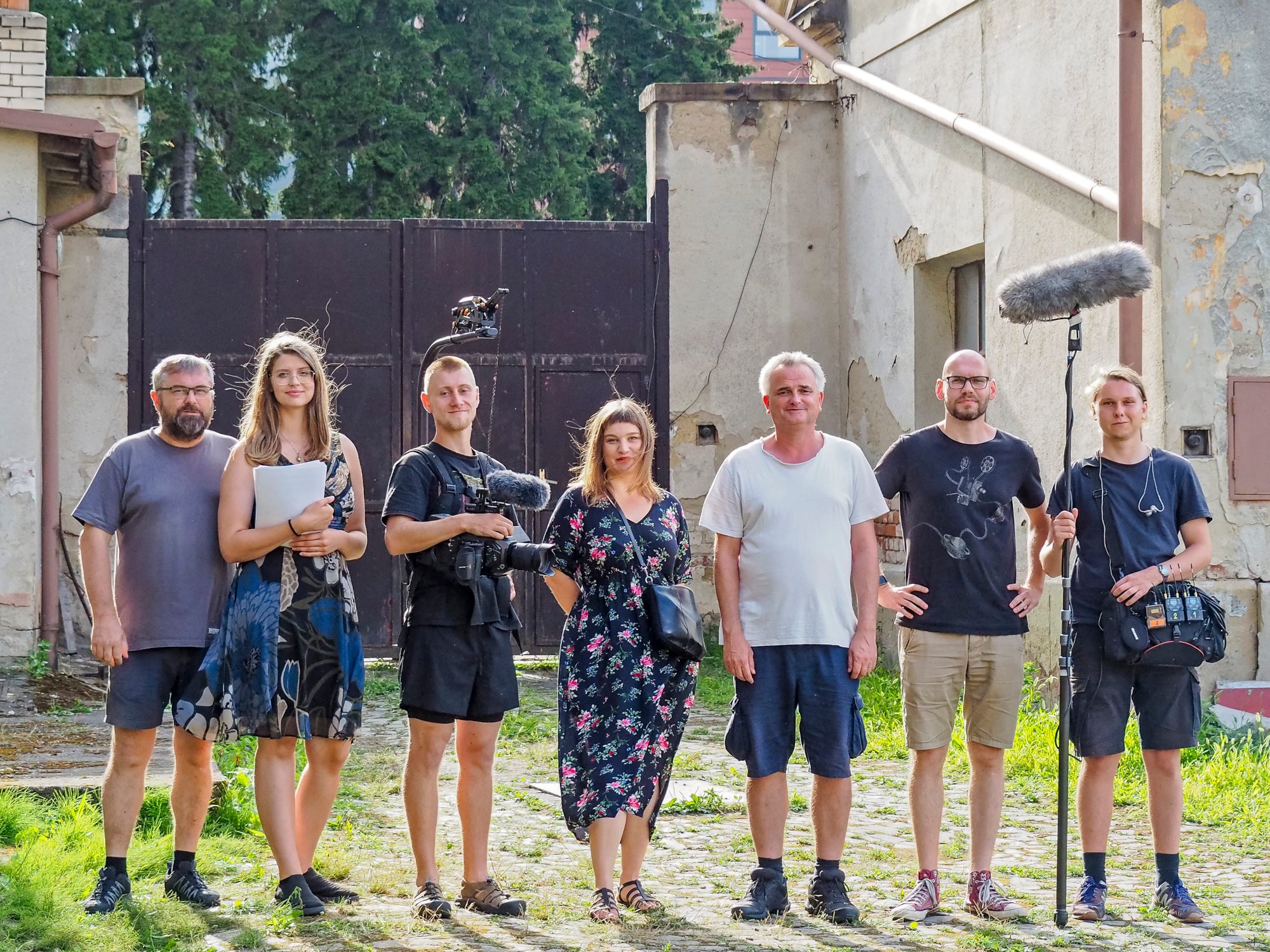 The film crew of <b><i>The Prison of History</i></b> in the yard of the Uherské Hradiště prison.  From left: creative producer Michal Stránský, producer Martina Chytková, director of photography Adam Černich, producer and chairwoman of Memoria Anna Stránská, directors Jan Gogola Jr. and Matěj Hrudička and sound engineer Vincent Stránský. Source crew archive