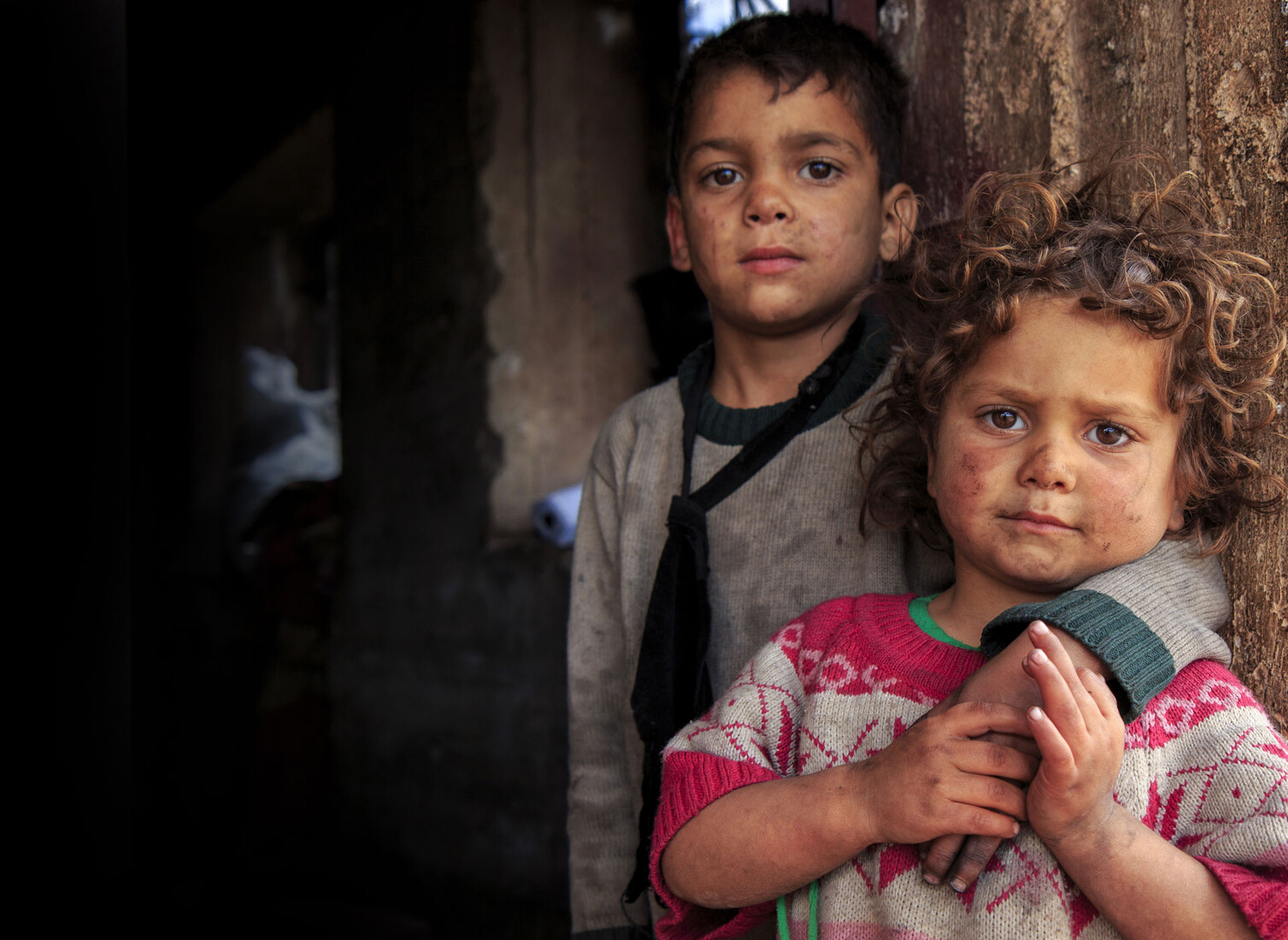 To hear children weeping in a photograph